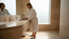 Elegant bathroom with travertine tiles and vanity
