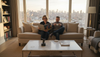 Couple relax in luxury penthouse living room