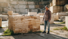 Stone mason inspects travertine quarry block