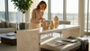 Designer arranging travertine accessories in penthouse