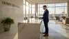 Concierge at marble reception desk in lobby