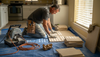 Installer preparing travertine decor workflow