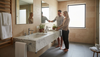 Couple arranging items on luxury stone vanity