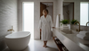 Woman in stone bathroom with soaking tub
