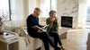 Couple relaxing in luxury marble living room