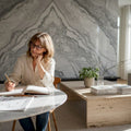 Designer sketching marble and travertine interior scene