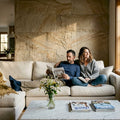 Couple relaxing in stone-accented living room
