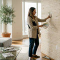 Designer checking travertine wall in luxury living room