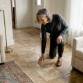 Designer inspecting travertine patina floor