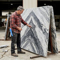 Fabricator examines bookmatched marble slabs