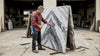 Fabricator examines bookmatched marble slabs