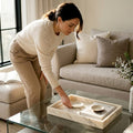 Person arranging luxury stone home accessories