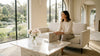 Sunlit living room with marble coffee table