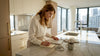 Designer examining polished marble on kitchen island