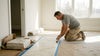 Installer checks marble floor in home
