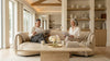 Couple reading in living room with marble coffee table